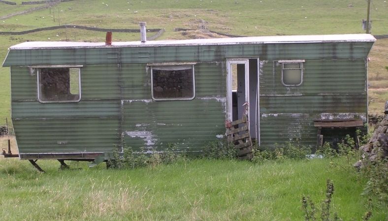 A very dirty old static caravan in poor condition